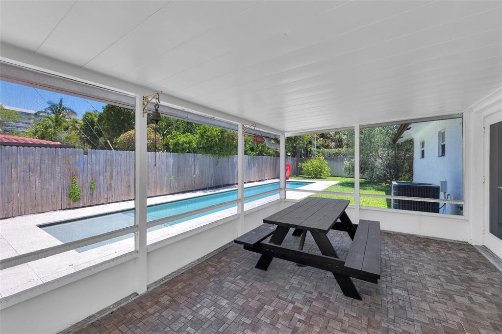 3213 Dover Road Pompano Beach, FL 33062 - Photo 17 of 53 a view of a patio with table and chairs next to a yard