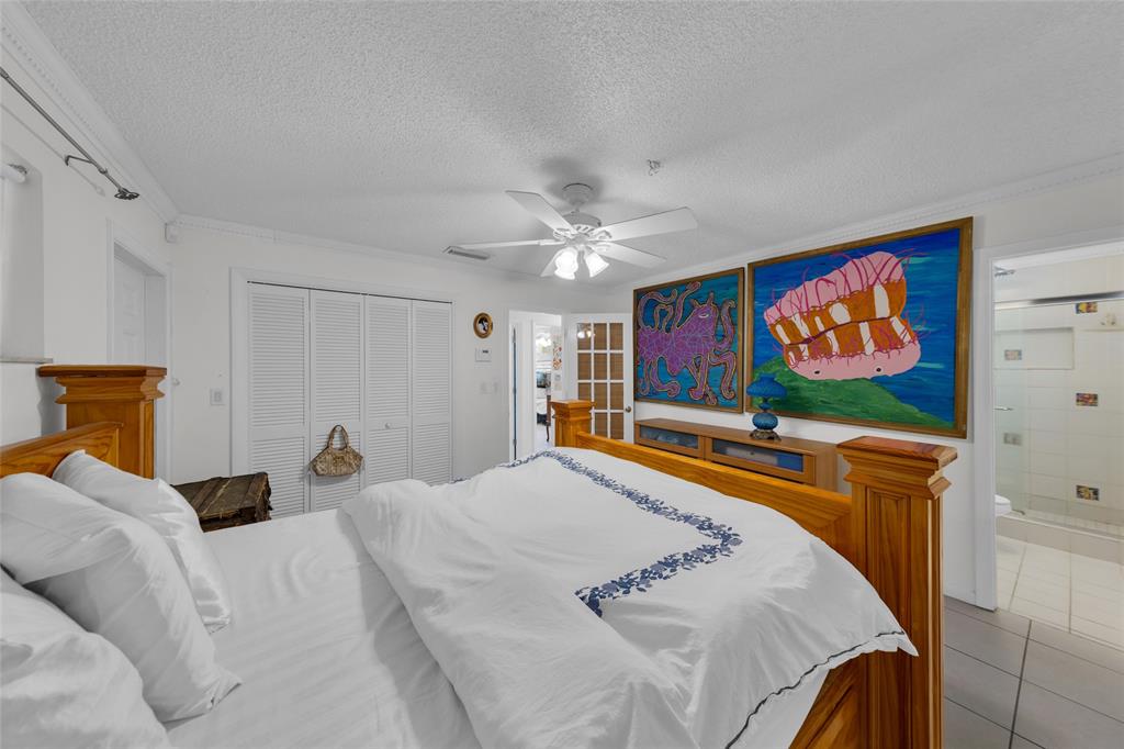 3213 Dover Road Pompano Beach, FL 33062 - Photo 23 of 53 a bed room with two bed and a flat screen tv