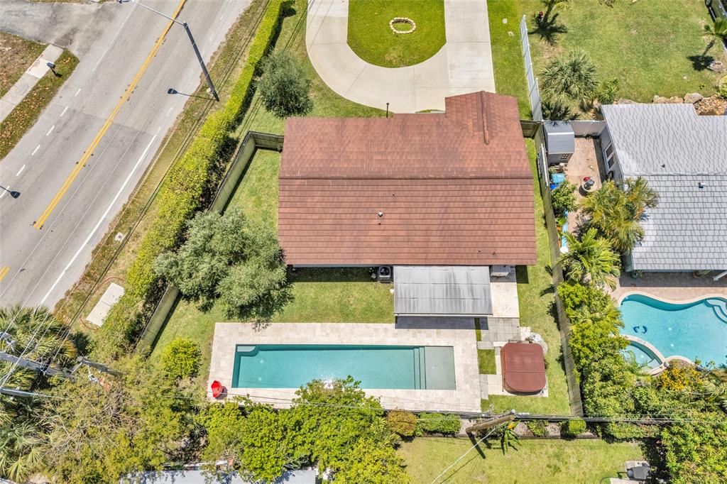 3213 Dover Road Pompano Beach, FL 33062 - Photo 47 of 53 an aerial view of a house with a swimming pool