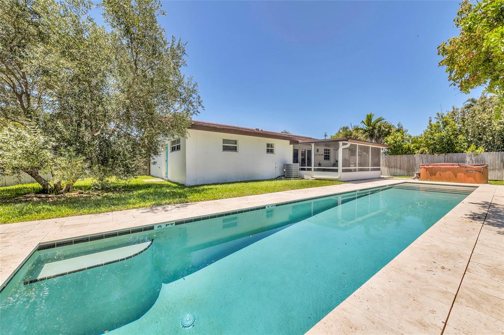3213 Dover Road Pompano Beach, FL 33062 - Photo 10 of 53 a view of swimming pool with a yard