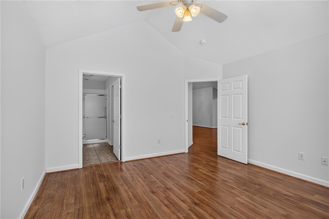 134 Life Style Lane Anderson, SC 29621 - Photo 20 of 44 An inviting room boasts soaring vaulted ceilings and gleaming hardwood floors, creating an airy ambiance.