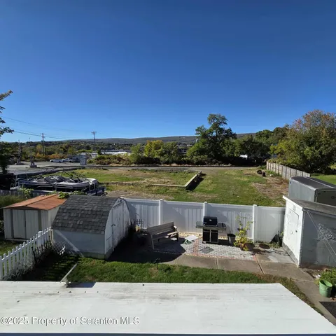 a view of a lake with houses in the back
