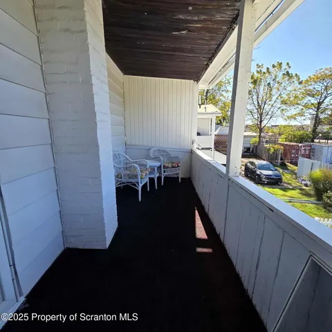 a kitchen with a wooden floor and a sink