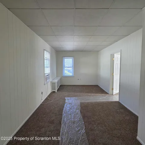 a view of an empty room and window