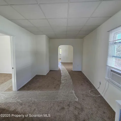 a view of a room with a dishwasher and a window