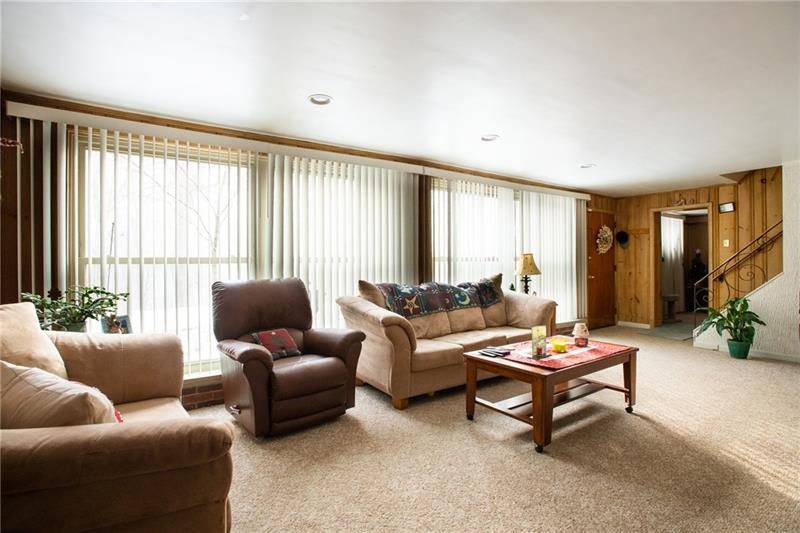 1117 Harvard Road Monroeville, PA 15146 - Photo 5 of 25 The living room has great featuresrecessed lighting, a fireplace, and neutral dcor.