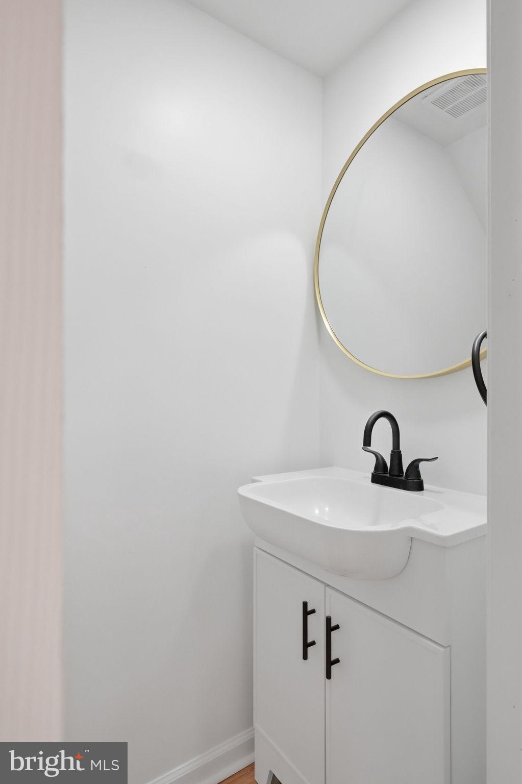 7413 Sommers Road Philadelphia, PA 19138 - Photo 17 of 54 a bathroom with a sink and a mirror