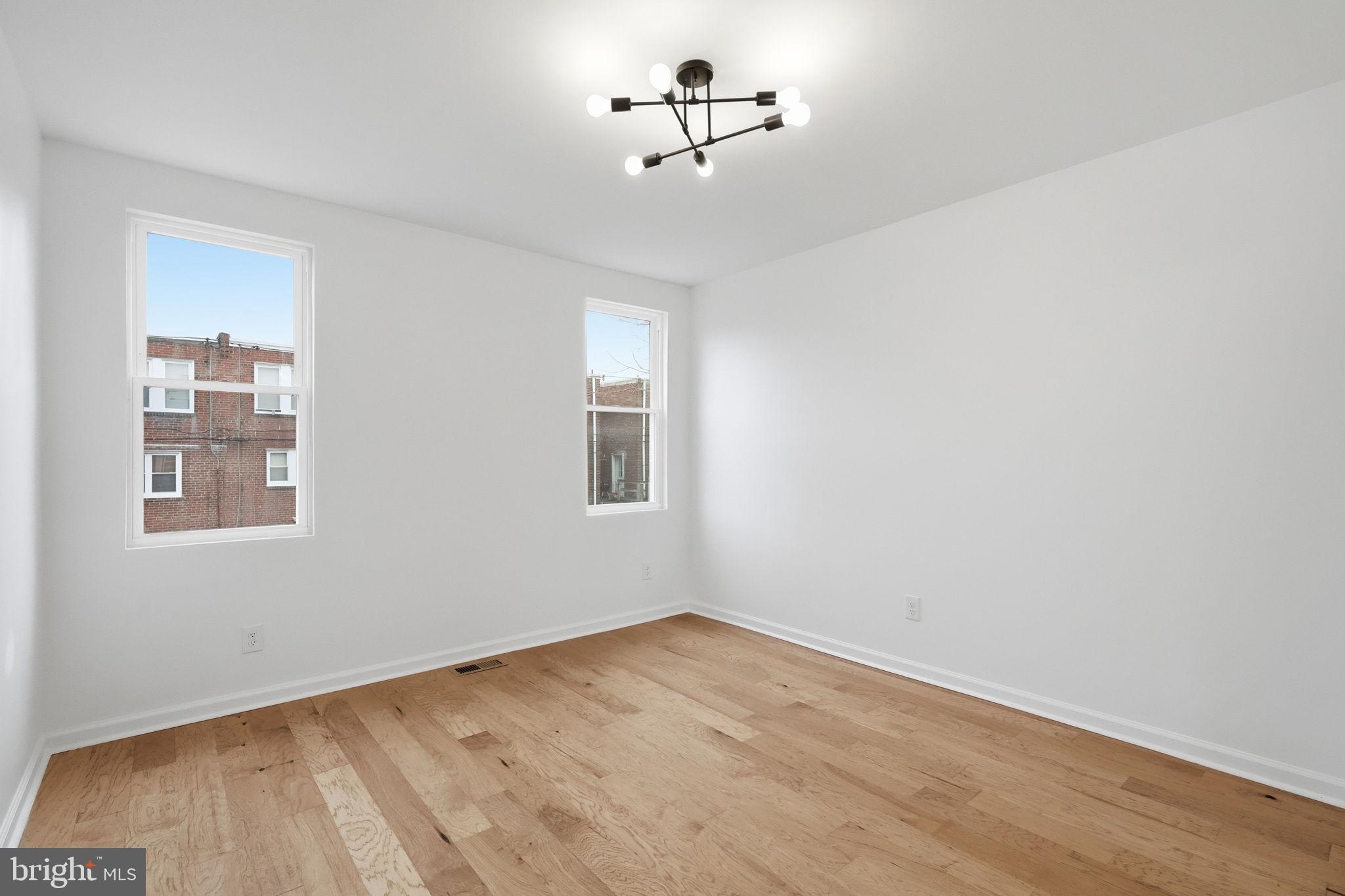 7413 Sommers Road Philadelphia, PA 19138 - Photo 34 of 54 a view of a room with wooden floor and ceiling fan
