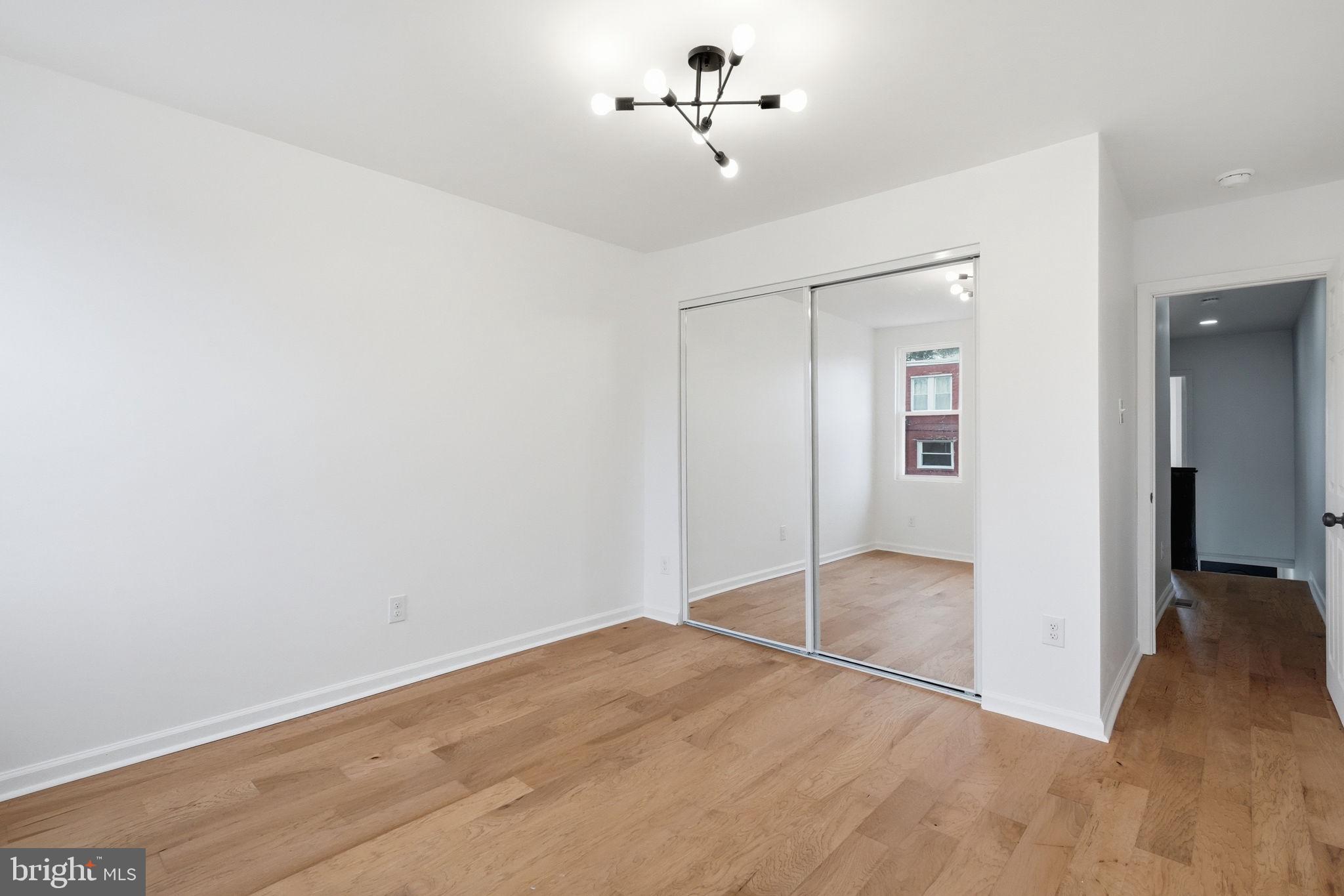7413 Sommers Road Philadelphia, PA 19138 - Photo 35 of 54 a view of empty room with wooden floor