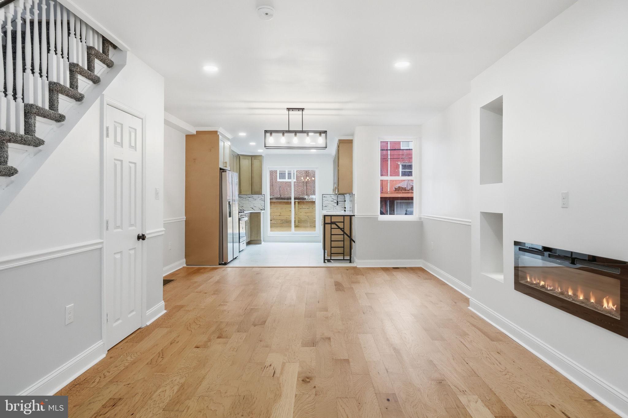 7413 Sommers Road Philadelphia, PA 19138 - Photo 4 of 54 a view of an empty room with window and wooden floor
