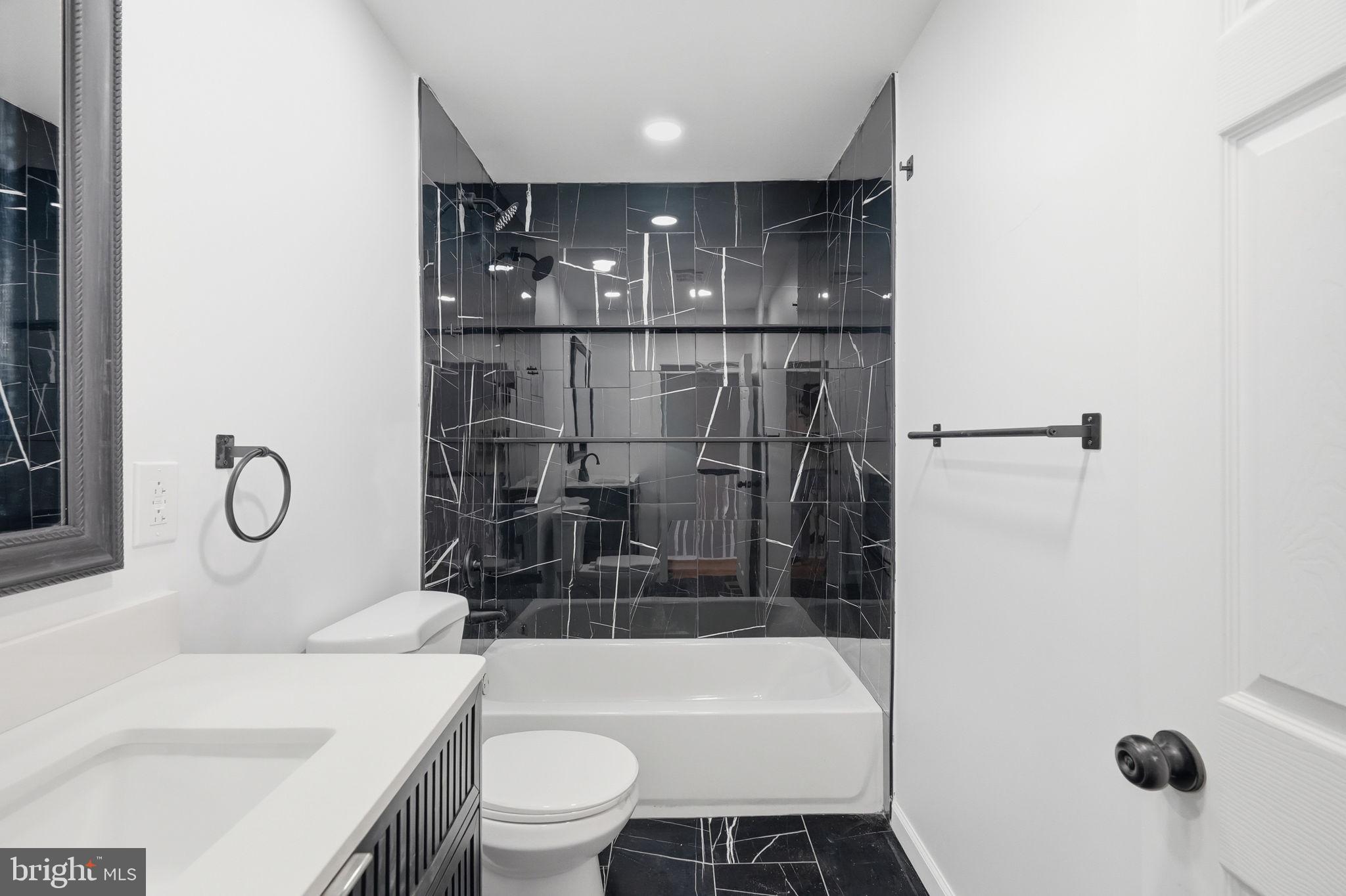 7413 Sommers Road Philadelphia, PA 19138 - Photo 42 of 54 a bathroom with a sink a toilet and shower