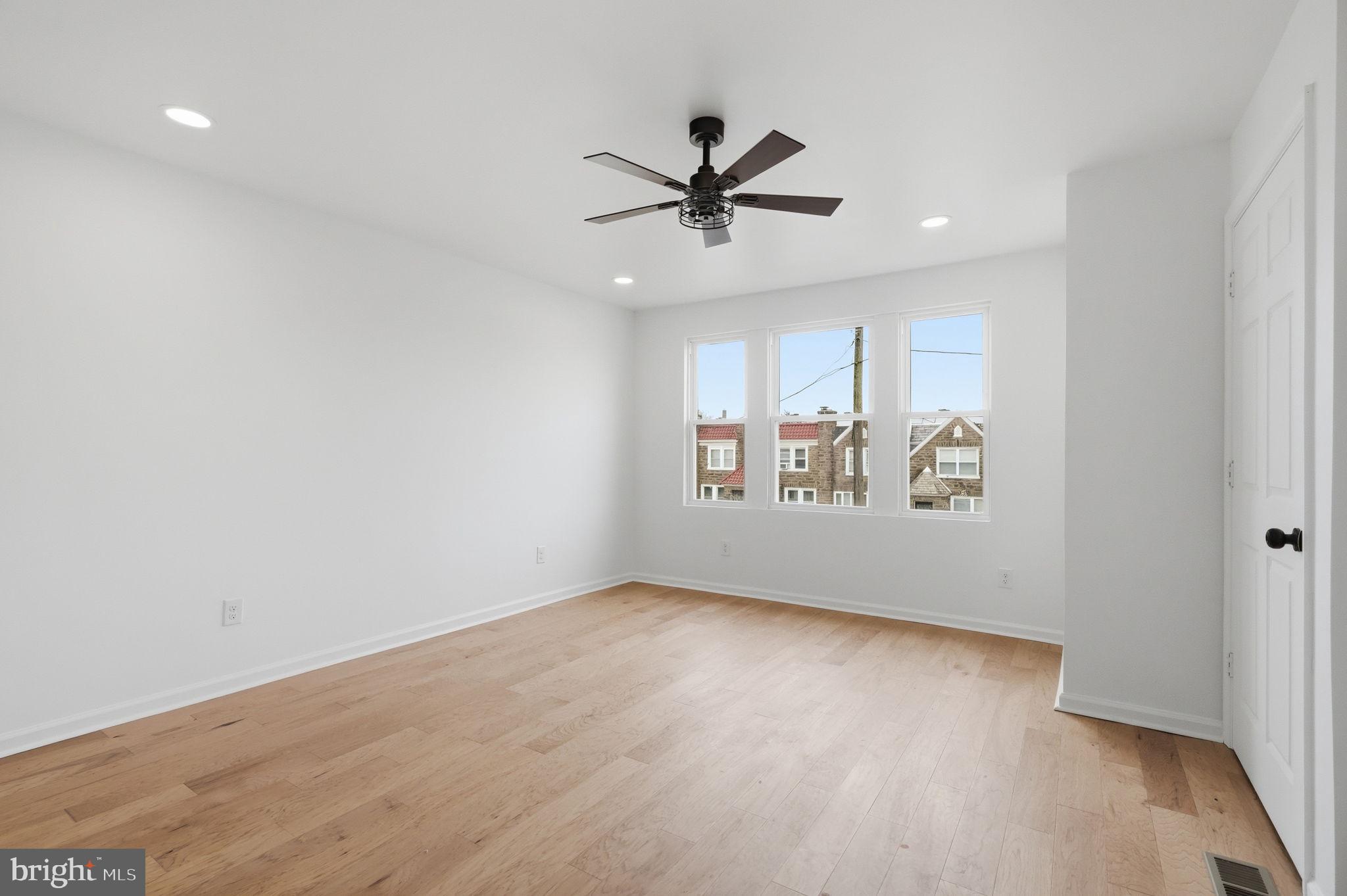 7413 Sommers Road Philadelphia, PA 19138 - Photo 44 of 54 wooden floor in an empty room with a window