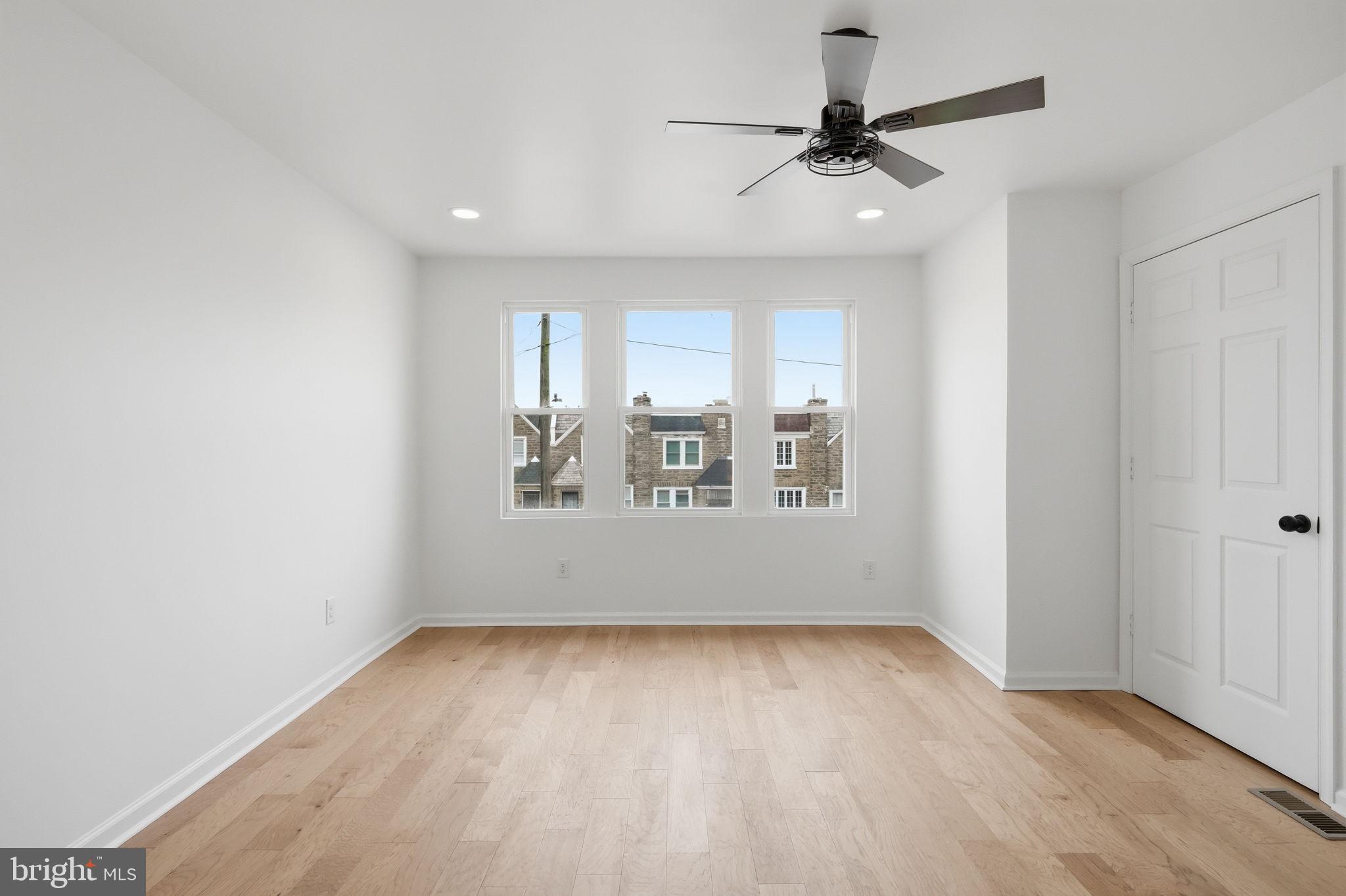 7413 Sommers Road Philadelphia, PA 19138 - Photo 45 of 54 wooden floor in an empty room with a window