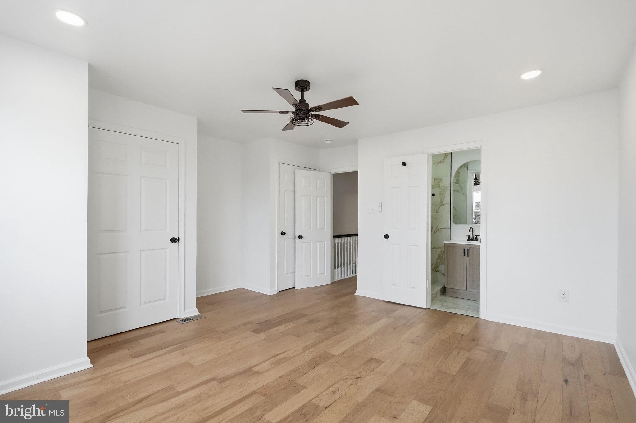 7413 Sommers Road Philadelphia, PA 19138 - Photo 47 of 54 a view of a room with wooden floor and a ceiling fan
