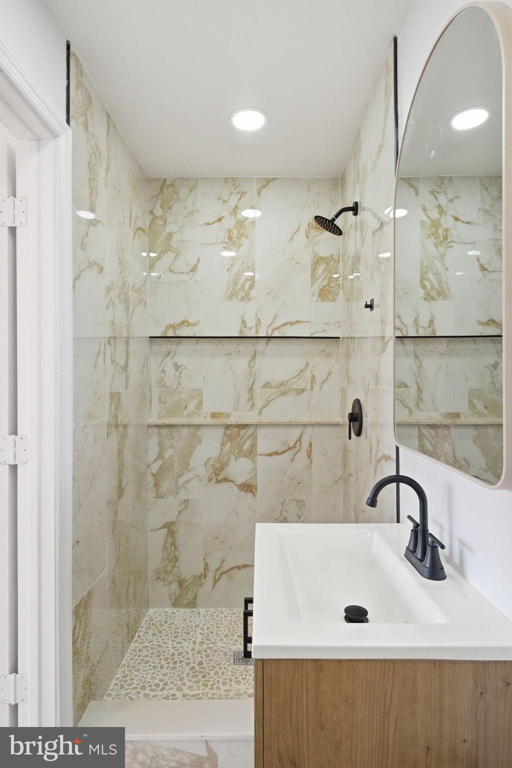 7413 Sommers Road Philadelphia, PA 19138 - Photo 50 of 54 a bathroom with a sink and a shower