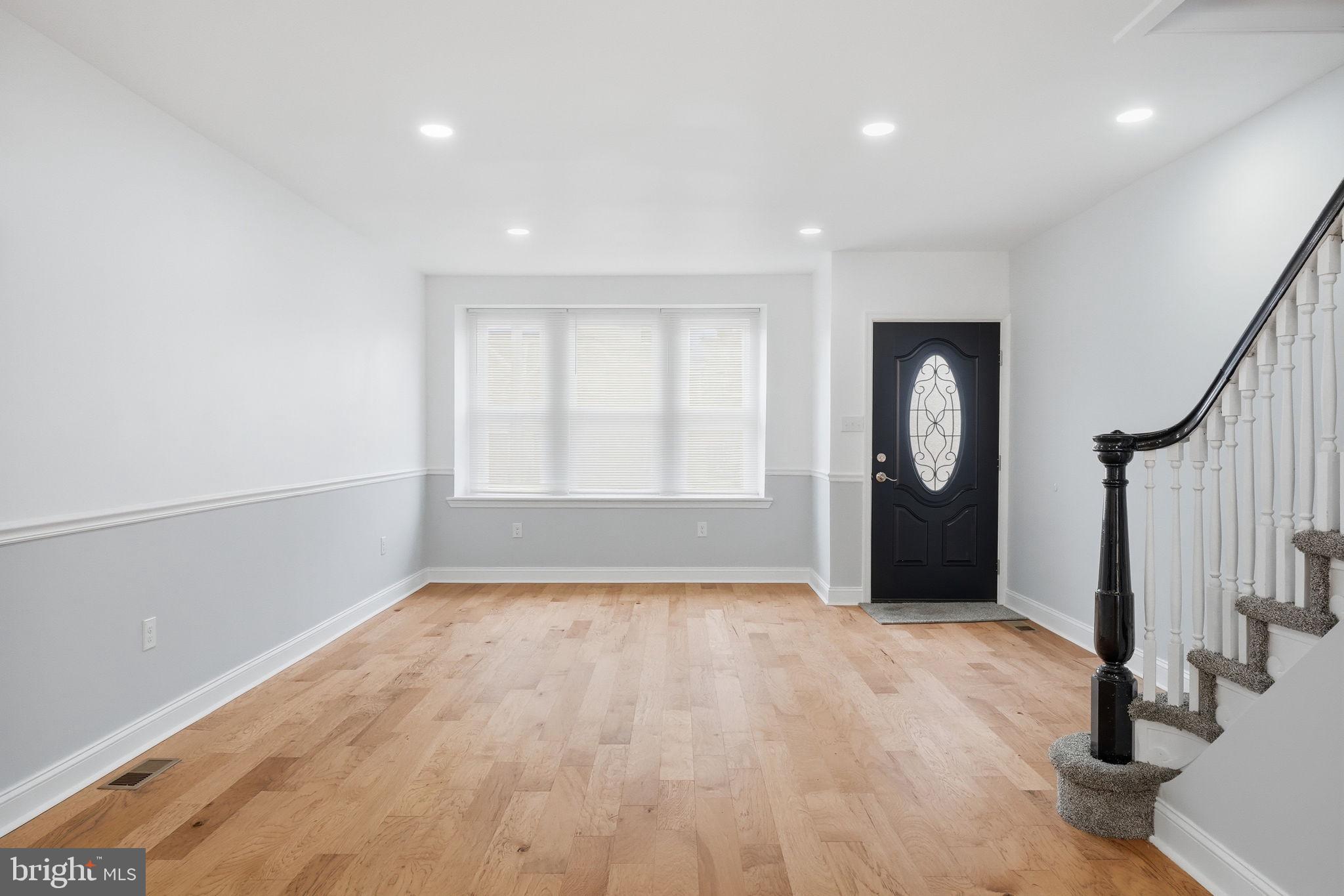 7413 Sommers Road Philadelphia, PA 19138 - Photo 5 of 54 an empty room with wooden floor and windows