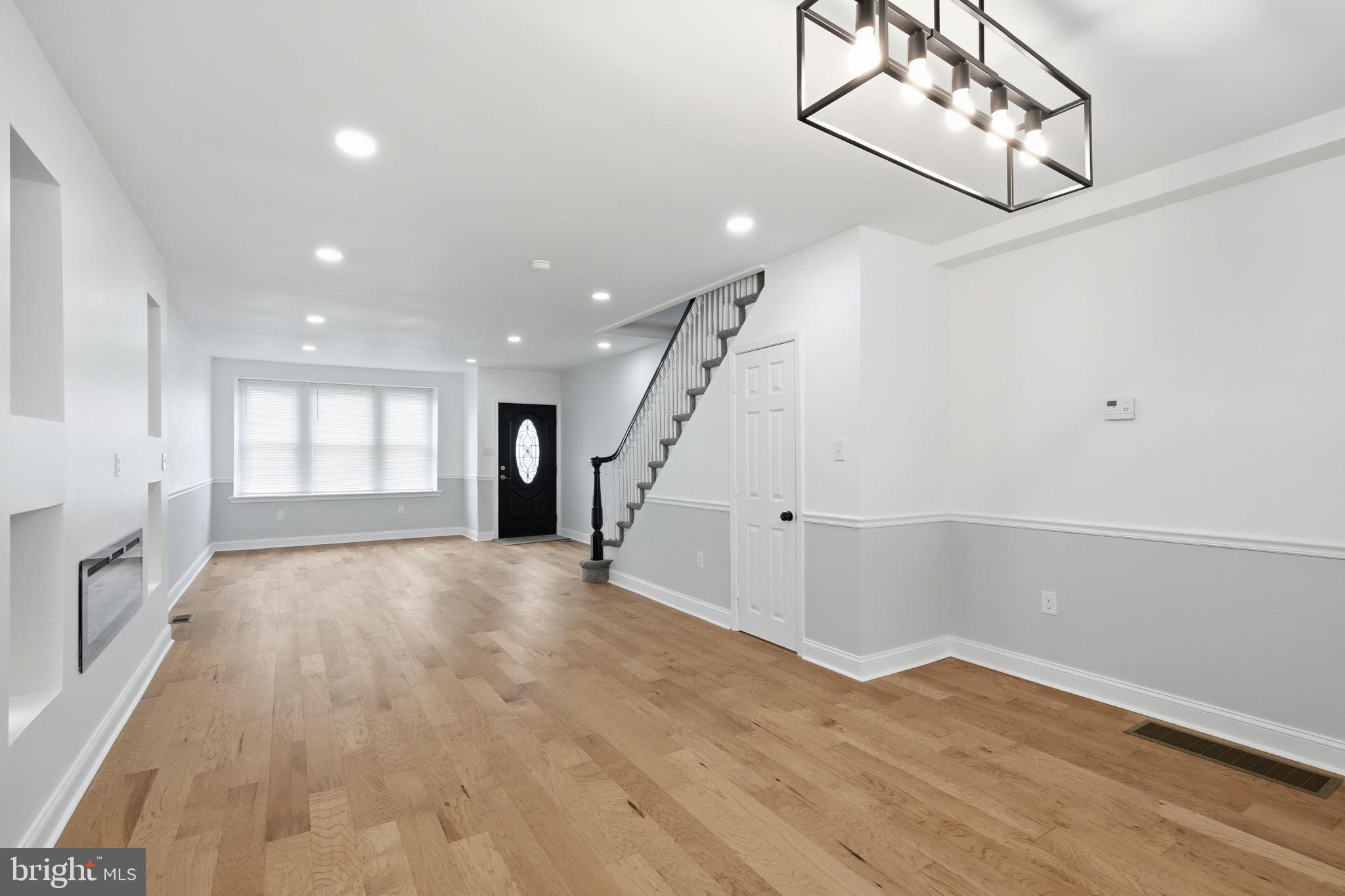 7413 Sommers Road Philadelphia, PA 19138 - Photo 6 of 54 a view of an empty room with wooden floor and stairs