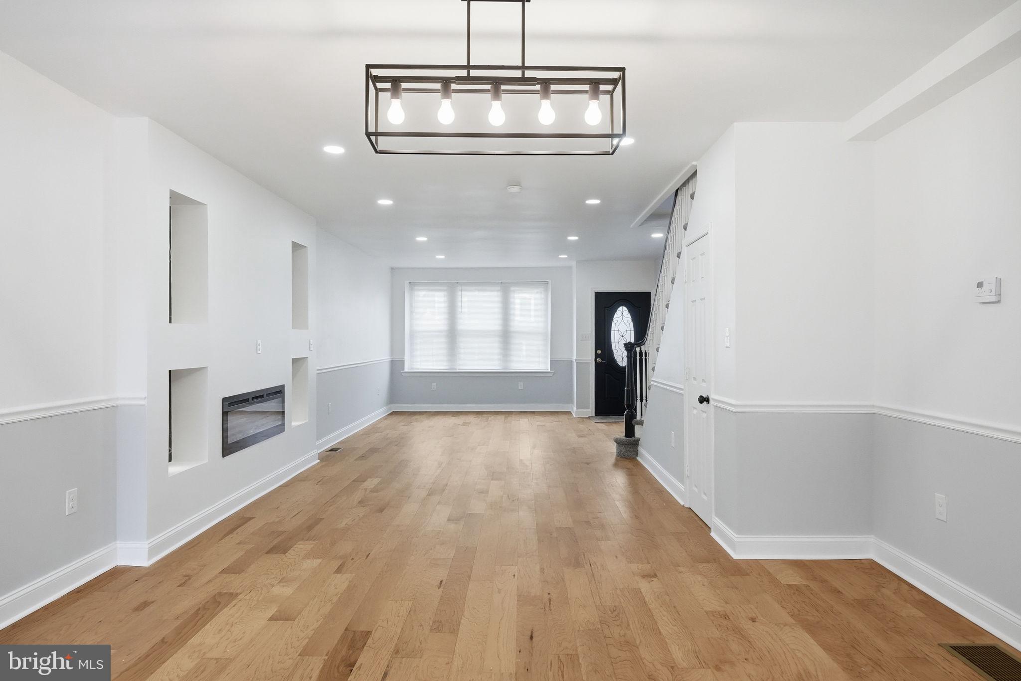 7413 Sommers Road Philadelphia, PA 19138 - Photo 7 of 54 a view of a livingroom with wooden floor and staircase