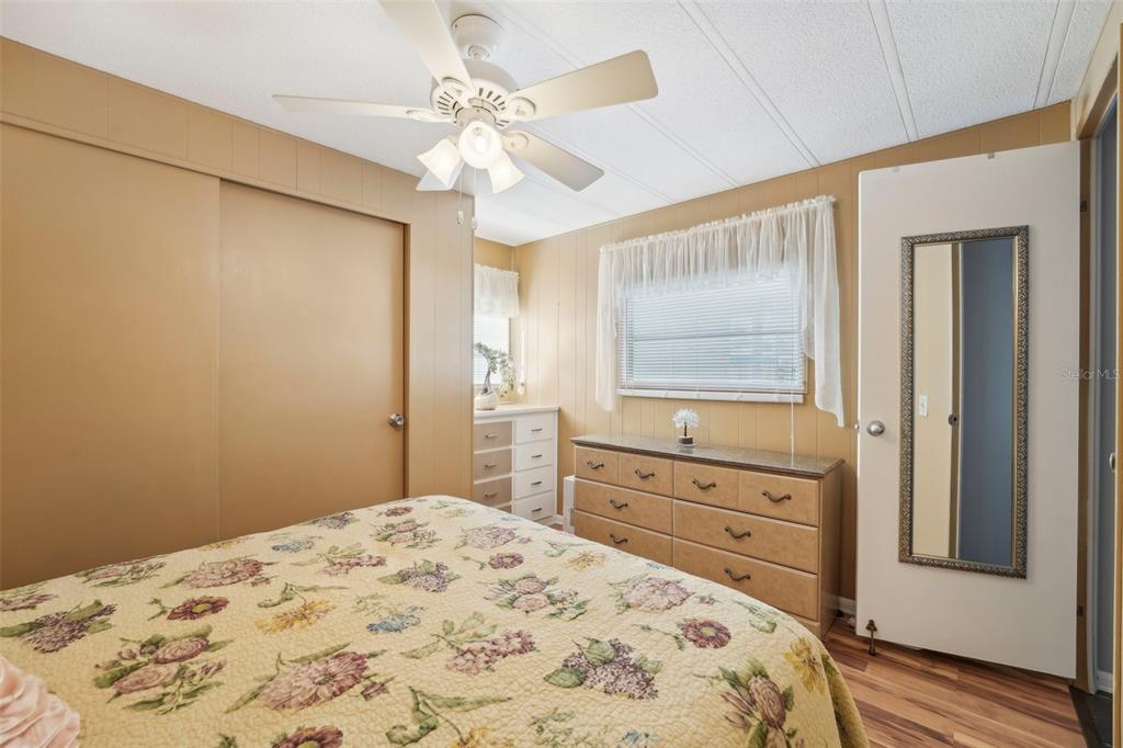 1600 Old Coachman Rd., Unit 709 Clearwater, FL 33765 - Photo 18 of 23 a bedroom with a bed dresser and a window