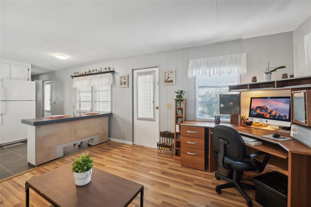 1600 Old Coachman Rd., Unit 709 Clearwater, FL 33765 - Photo 5 of 23 a living room with furniture and a flat screen tv