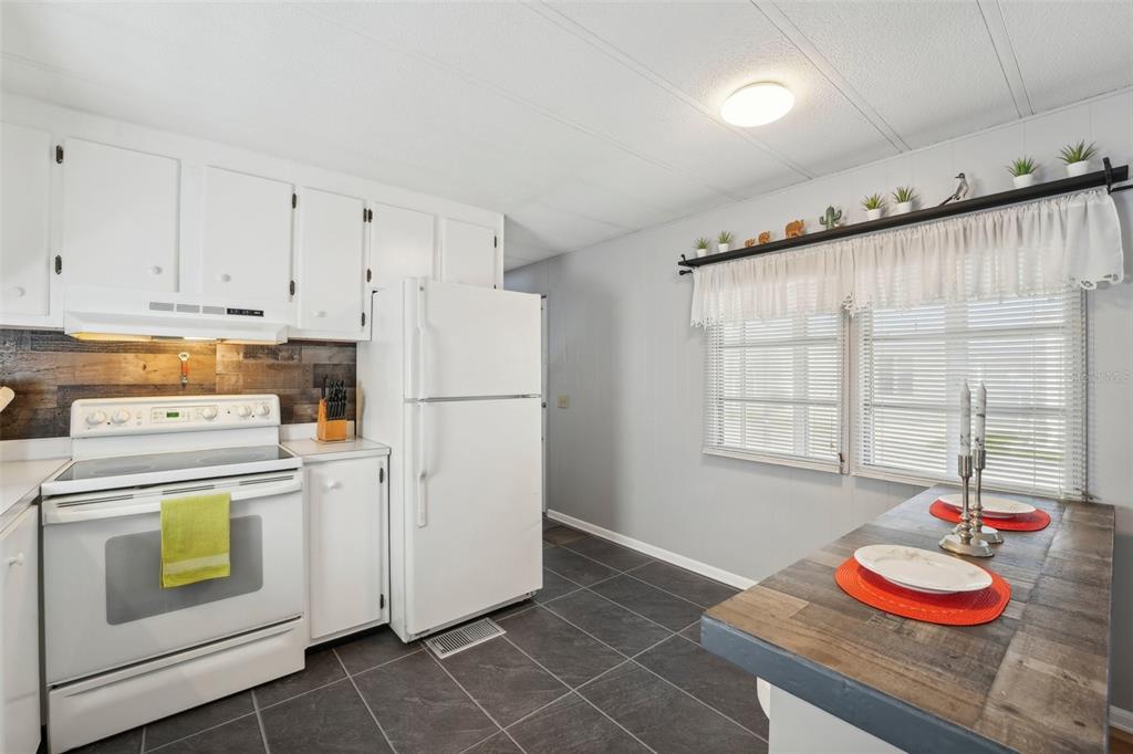 1600 Old Coachman Rd., Unit 709 Clearwater, FL 33765 - Photo 10 of 23 a kitchen with appliances and cabinets