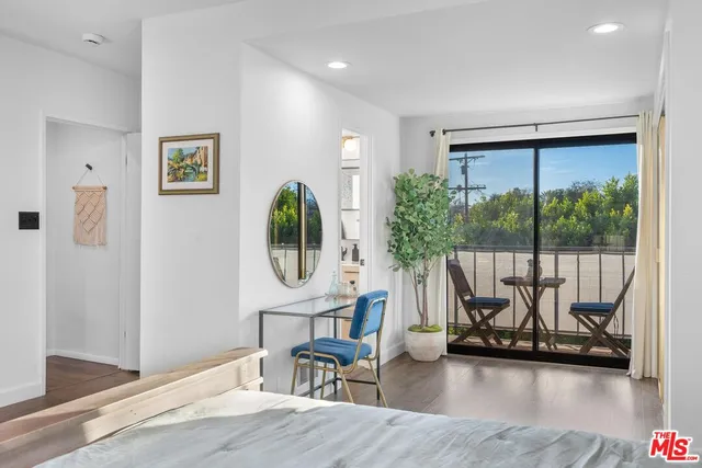 a view of a room with gym equipment and a floor to ceiling window