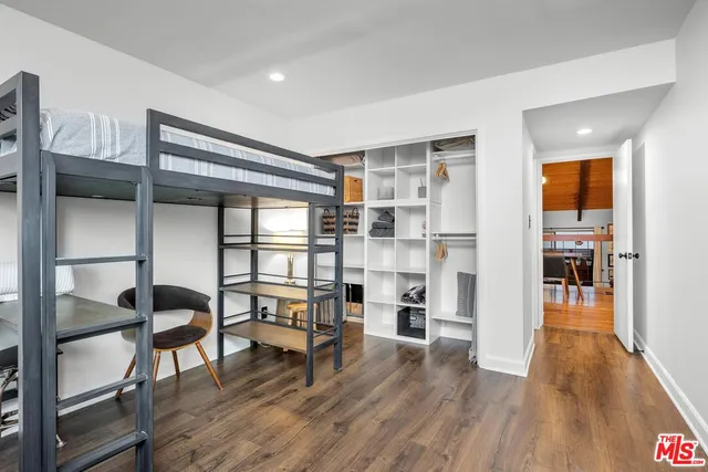 a view of a livingroom with furniture and wooden floor
