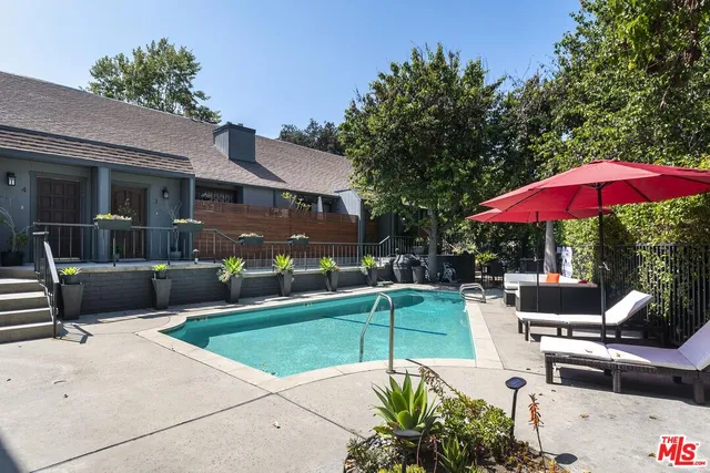 an outdoor sitting area with furniture