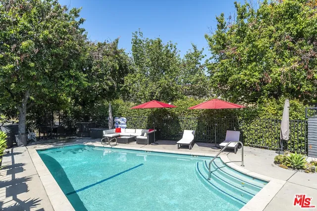 a view of a chairs and table in the patio