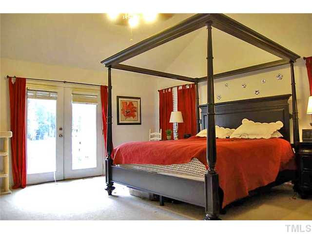 230 W Road Angier, NC 27501 - Photo 4 of 14 a bed sitting in a bedroom next to a window