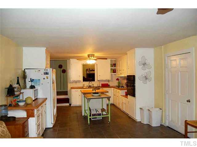 230 W Road Angier, NC 27501 - Photo 5 of 14 a dining room with furniture and a table