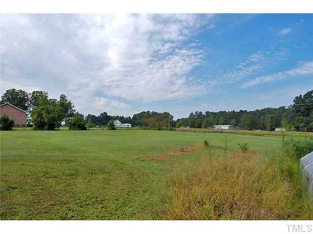 230 W Road Angier, NC 27501 - Photo 8 of 14 a view of a lake with a big yard