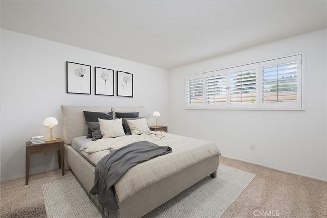 a bedroom with bed and a window