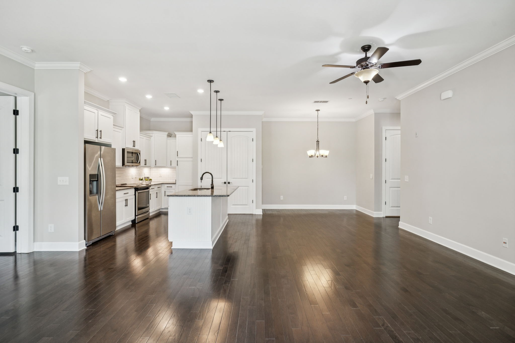 201 Swain Circle, Unit 104 Franklin, TN 37064 - Photo 12 of 45 a view of a kitchen with refrigerator and wooden floor