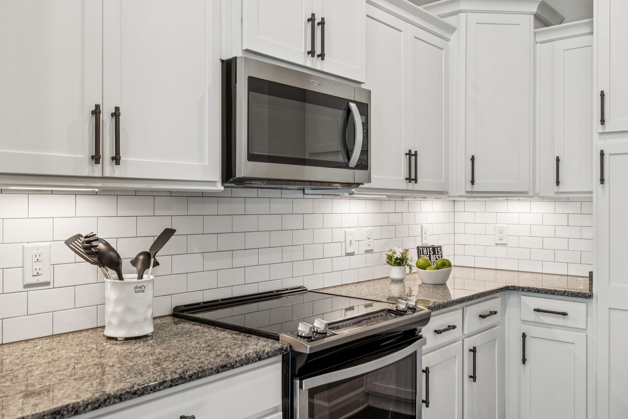 201 Swain Circle, Unit 104 Franklin, TN 37064 - Photo 15 of 45 a kitchen with granite countertop a sink stainless steel appliances and cabinets