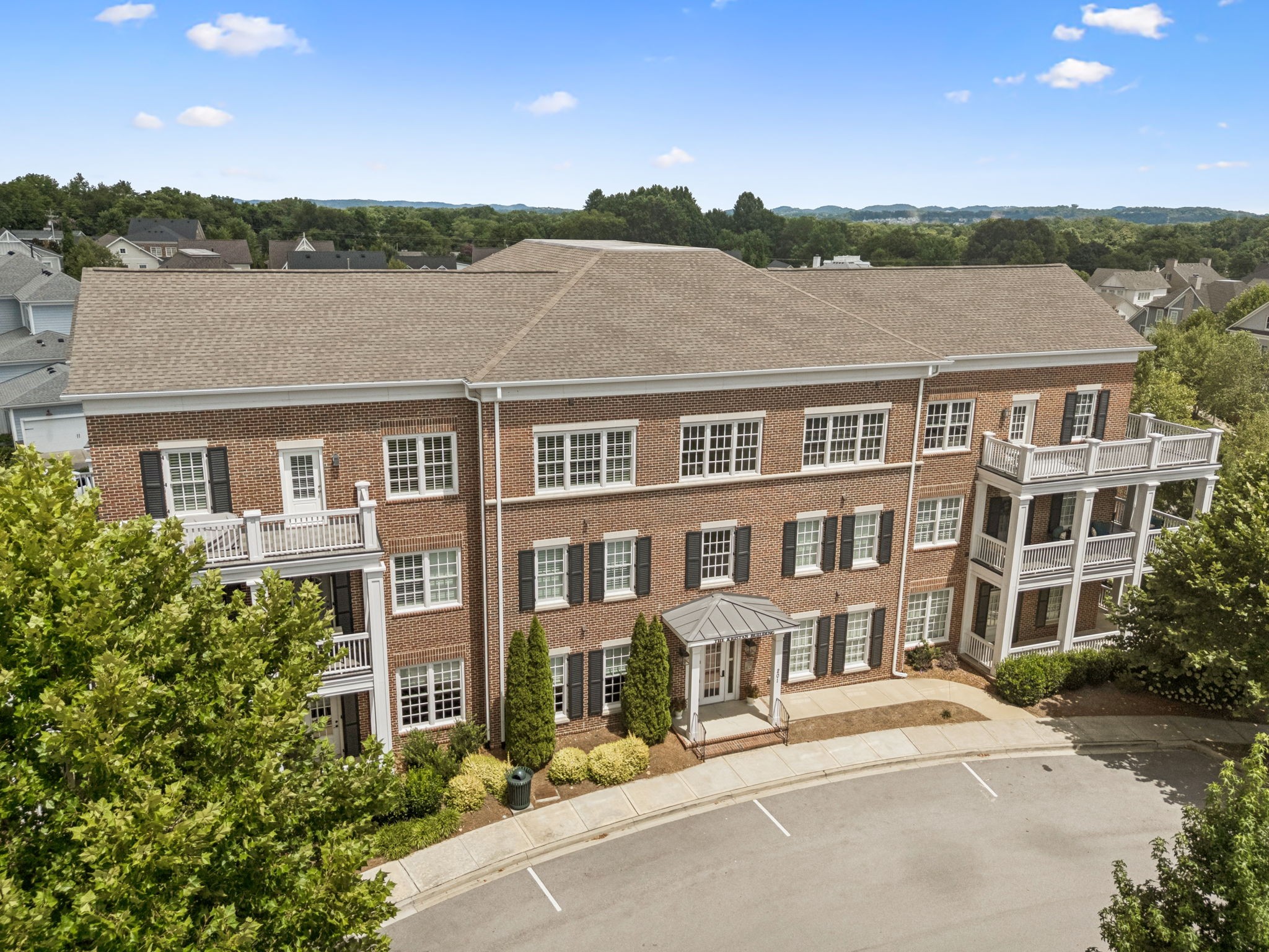 201 Swain Circle, Unit 104 Franklin, TN 37064 - Photo 22 of 45 front view of a house with a yard