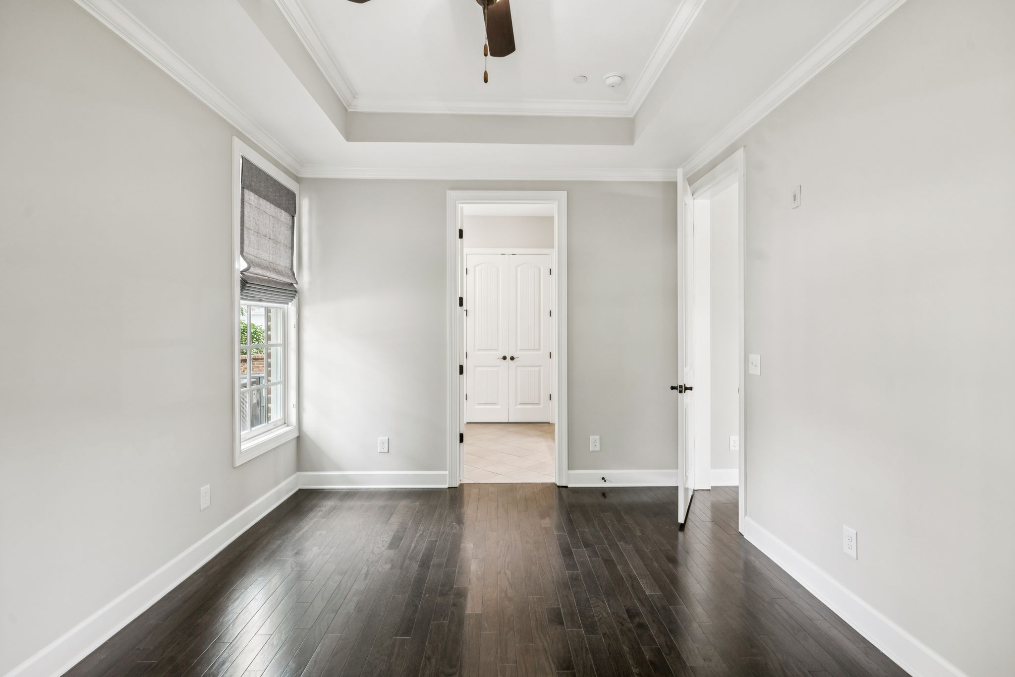 201 Swain Circle, Unit 104 Franklin, TN 37064 - Photo 30 of 45 an empty room with wooden floor and windows