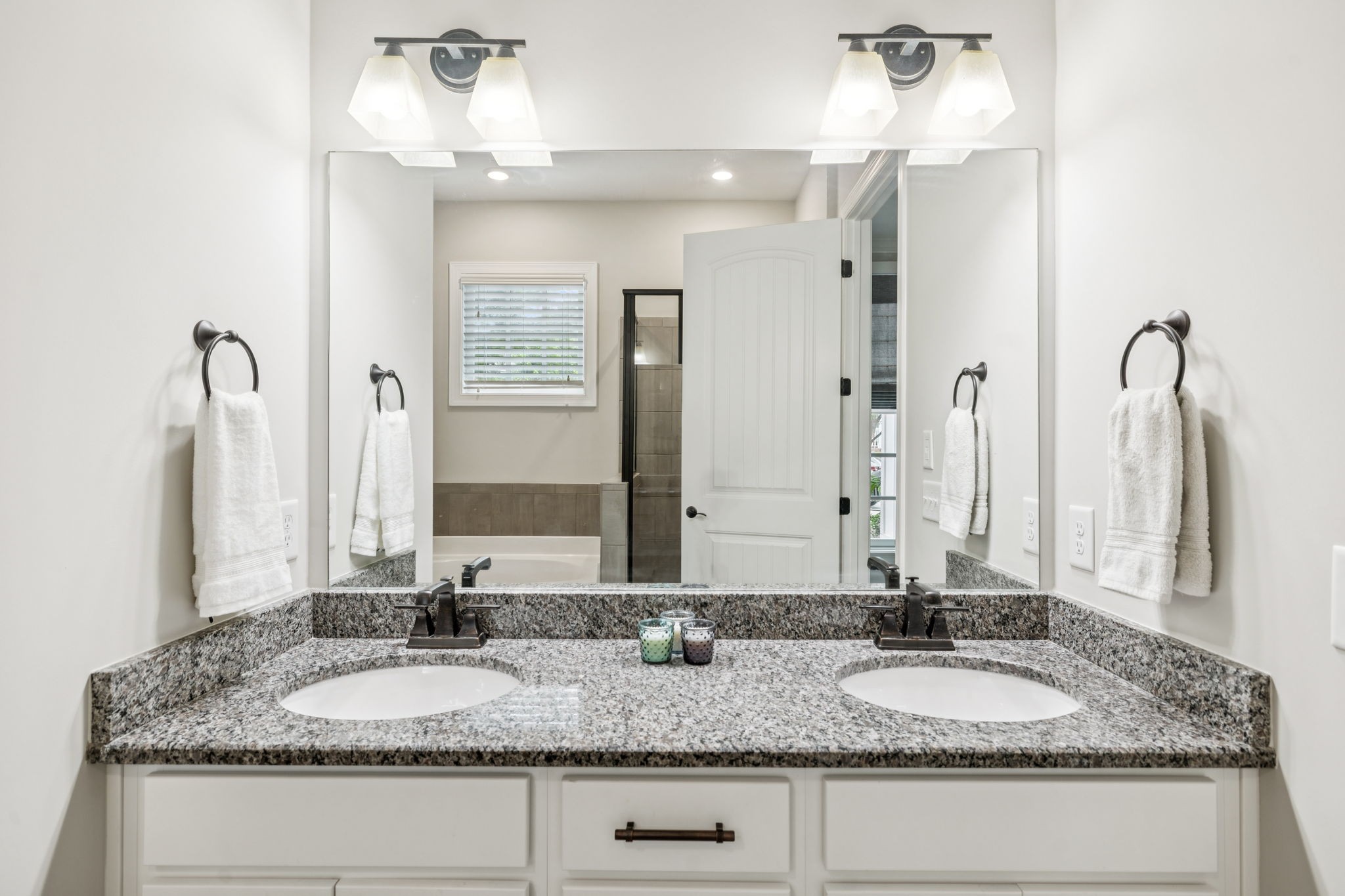 201 Swain Circle, Unit 104 Franklin, TN 37064 - Photo 32 of 45 a bathroom with double vanity sinks granite vanity and a mirror