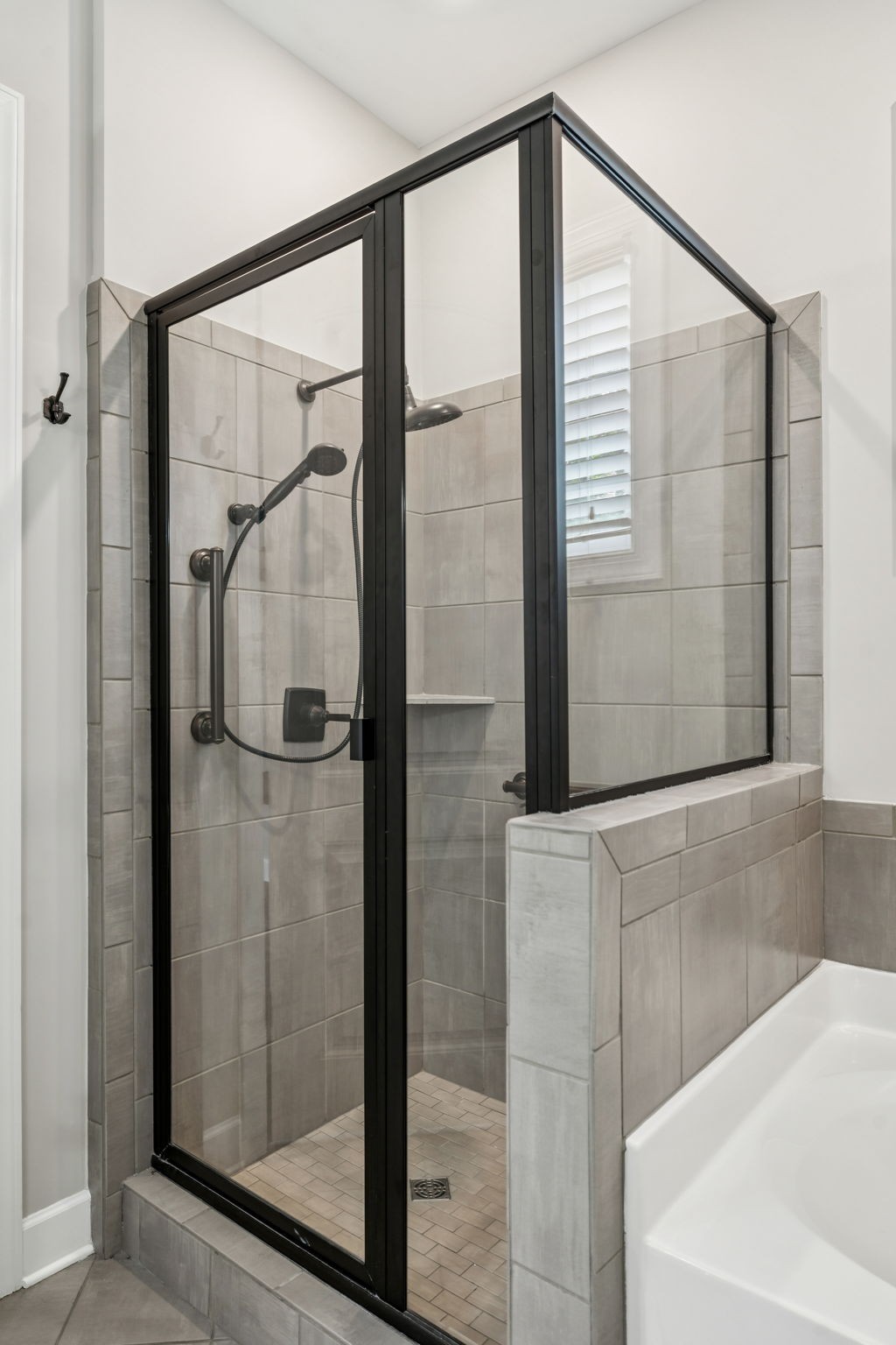 201 Swain Circle, Unit 104 Franklin, TN 37064 - Photo 34 of 45 a bathroom with a bathtub and a shower