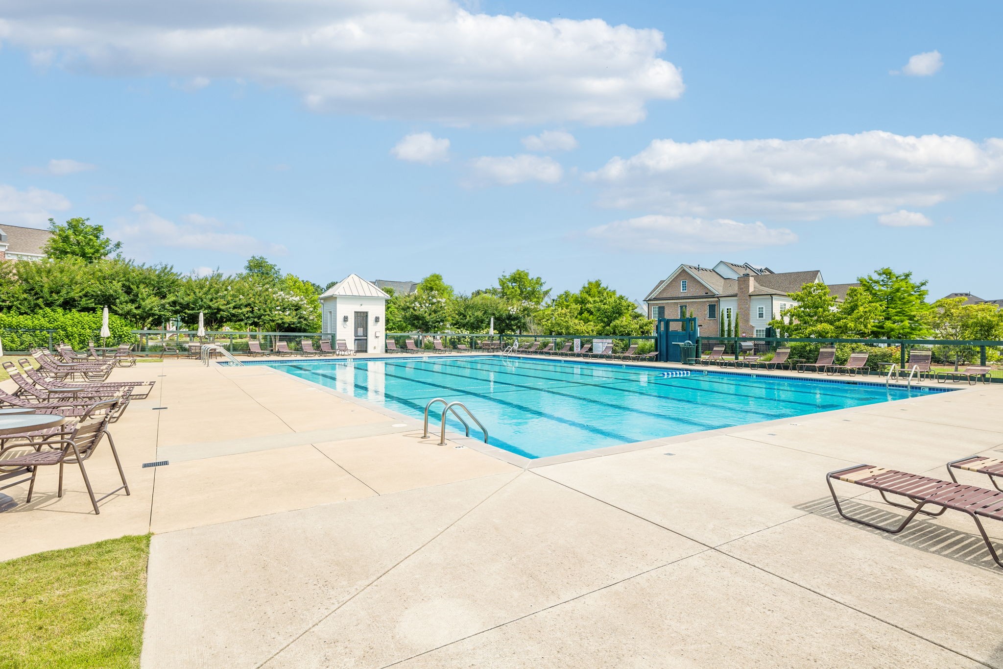 201 Swain Circle, Unit 104 Franklin, TN 37064 - Photo 44 of 45 a view of swimming pool that has lawn chairs with plants and trees