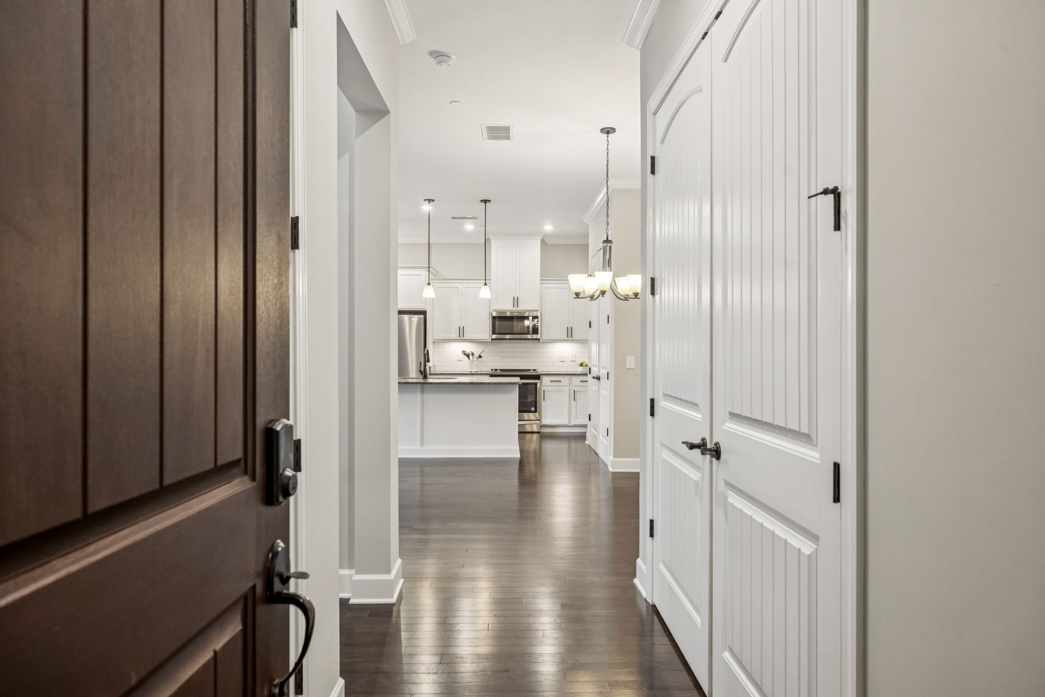 201 Swain Circle, Unit 104 Franklin, TN 37064 - Photo 5 of 45 a view of a hallway with wooden floor windows and livingroom view