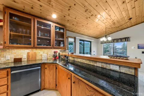 a view of a kitchen with a sink and cabinets