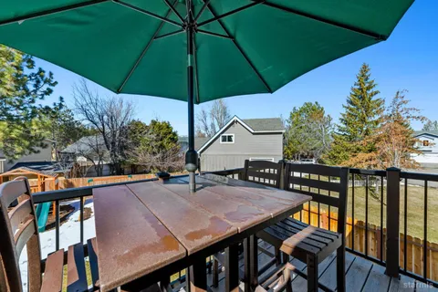 an outdoor space with furniture and umbrella