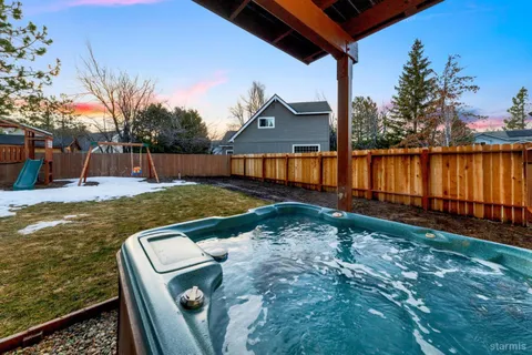 a view of a backyard with lake view