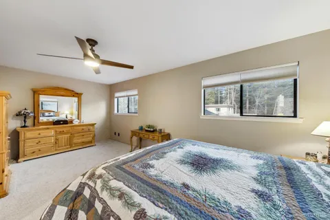 a bed room with a bed and a chandelier
