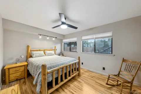 a bed room with furniture and a flat screen tv