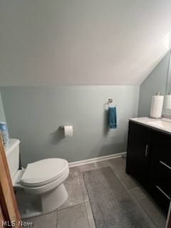 1559 Chelmsford Road Cleveland, OH 44124 - Photo 9 of 29 Bathroom with vaulted ceiling, tile flooring, vanity, and toilet