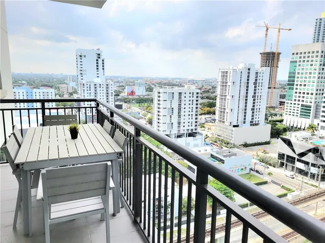 a view of balcony with furniture