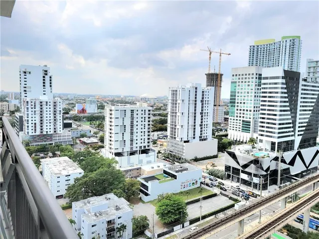 a view of balcony with furniture and city view