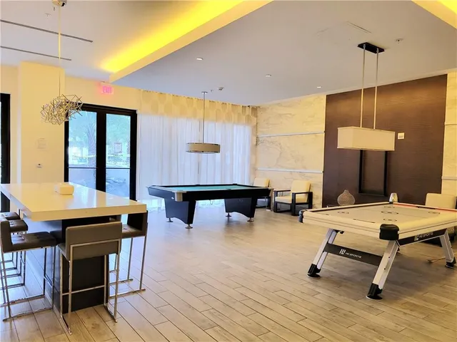 a room with lots of furniture and windows